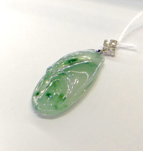 A stunning close-up of the Natural Jadeite Bud Pendant, showcasing its translucent green jadeite petals and sparkling diamond-adorned 18K white gold clasp. The intricate floral hollow-out design adds a touch of sophistication.