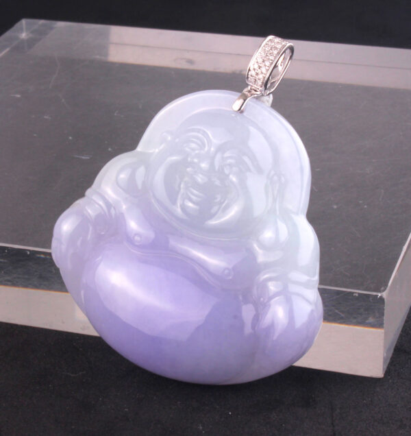 A stunning close-up of the Ice-Type Violet Jadeite Buddha Pendant, showcasing its translucent violet hue, intricate 18K white gold and diamond inlay, and serene sitting Buddha carving.