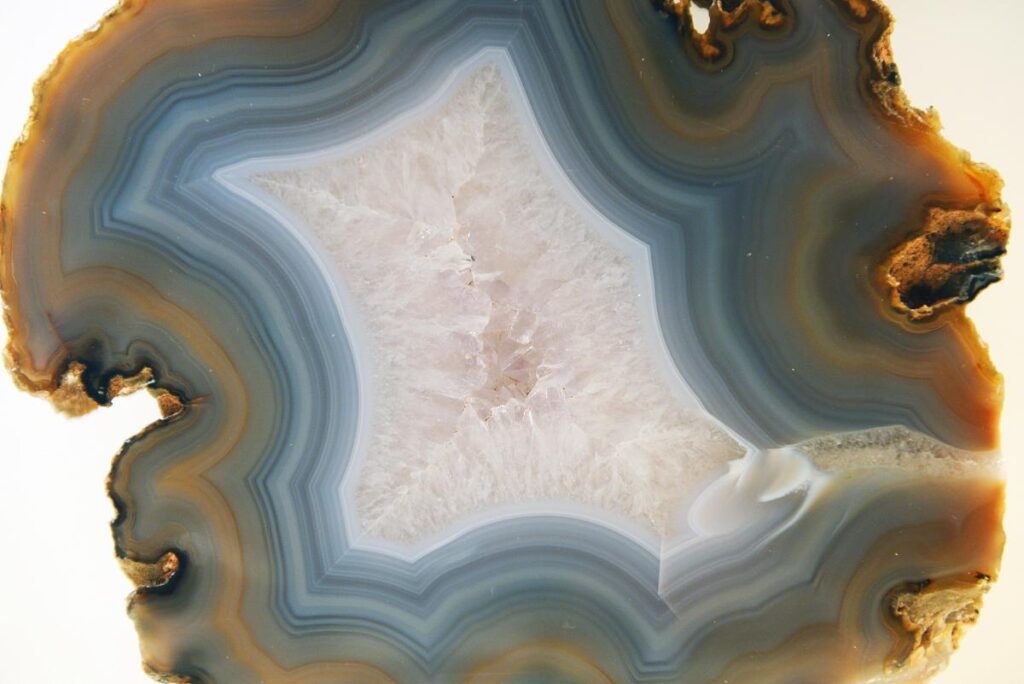 Jade minerals formed in rocks after magma cooling undergo a series of natural processes, including weathering, erosion, transportation, and deposition.