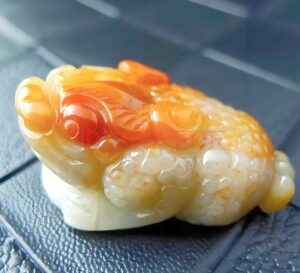 Pi xiu jadeite figurine positioned in traditional wealth corner