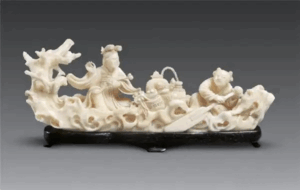 Modern mammoth-ivory masterpiece: two-meter-long ship sculpture with eleven open pavilions, 3,000 micro-figures, and wind-bell sails—proof of contemporary innovation.