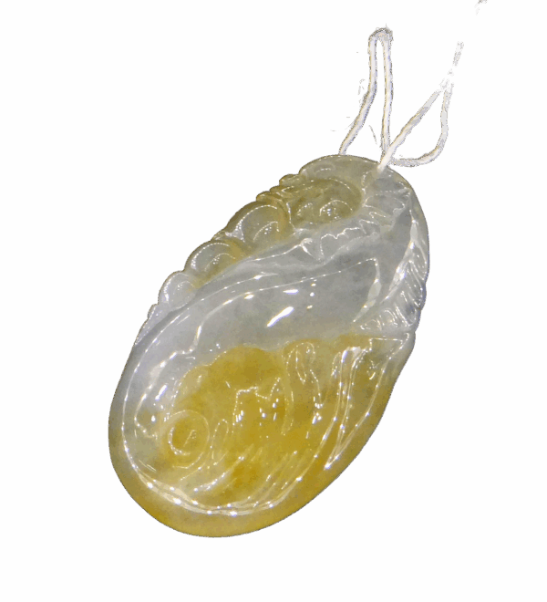 A stunning close-up of the Natural Jadeite Dragon Spitting Pearl Pendant, showcasing its intricate dragon carving and lustrous 18K gold clasp. The jadeite's warm tones and translucent details highlight its premium craftsmanship.