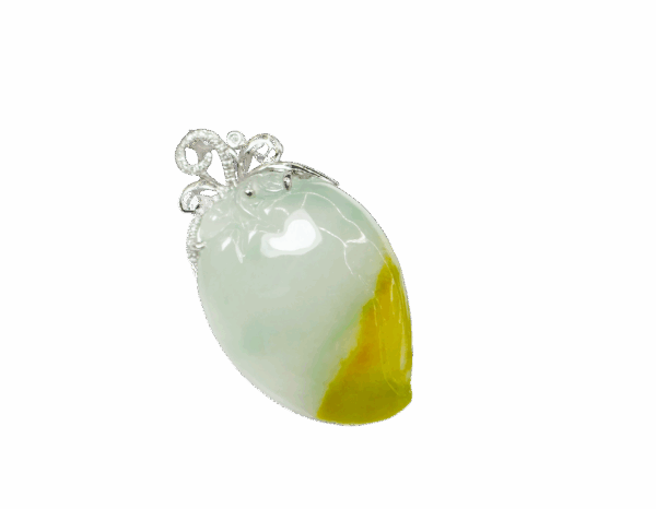 A stunning close-up of the Natural Ice-type Yellow Jadeite Peach Pendant, showcasing its translucent ice-like texture, warm yellow hues, and intricate 18K white gold and diamond clasp.