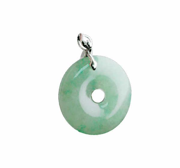 A stunning close-up of the Natural Ice Green Jade Peace Button Pendant, showcasing its ice-green hue and 18K white gold inlay. The pendant's smooth edges and intricate design highlight its craftsmanship and elegance.