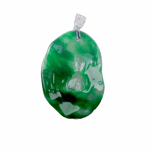 A stunning "Spicy Green" old pit emerald pendant featuring intricate "Enlightenment" carving, set in 18K white gold with sparkling diamond accents. The deep green gemstone contrasts elegantly with the gleaming metal.
