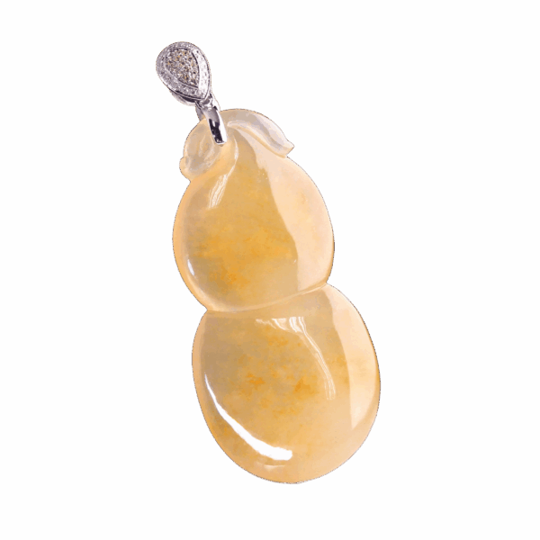 A stunning close-up of the Natural Ice-type Chicken-fat Yellow Jadeite Gourd Pendant, showcasing its translucent golden-yellow hue, intricate gourd carving, and sparkling 18K white gold clasp adorned with yellow and white diamonds.