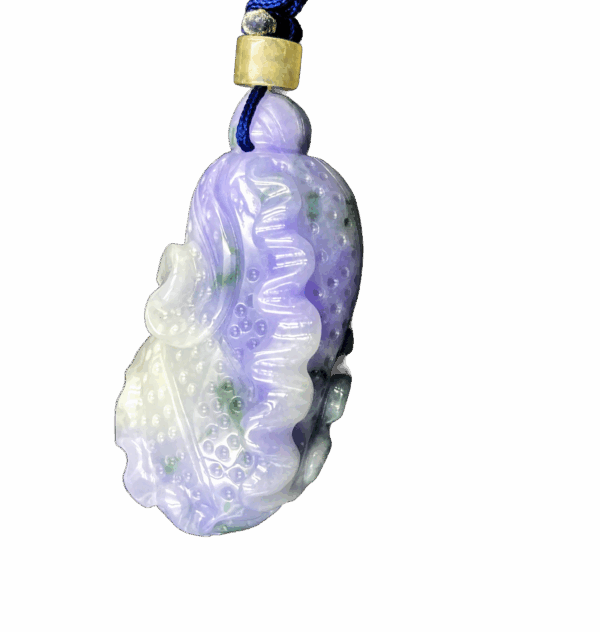 A finely carved violet jadeite pendant in the shape of a Chinese cabbage, showcasing soft purple tones with subtle green spots. The intricate leaf details and smooth polish highlight its natural beauty, elegantly suspended from a blue cord with a yellow bead accent.