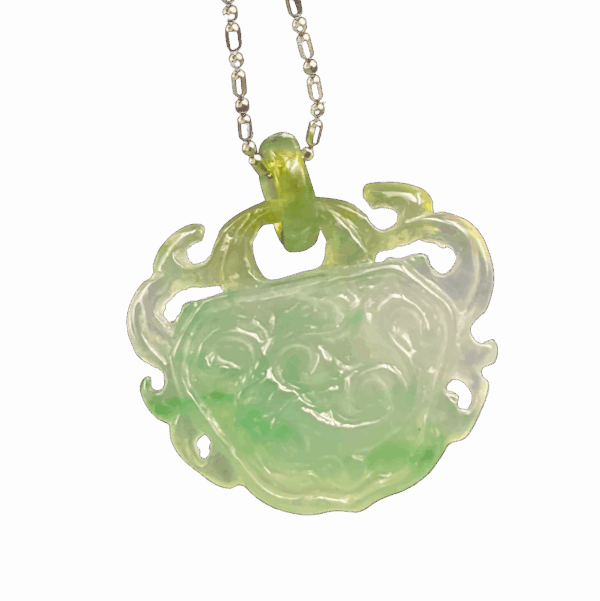 A stunning close-up of the Yellow and Green Jadeite Ruyi Pendant, showcasing its translucent icy jadeite with blended yellow and green tones. The intricate ruyi carving and polished metal chain highlight its elegance and craftsmanship.