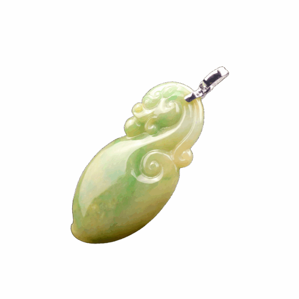 A stunning close-up of the Natural Yellow-Green Jadeite Dragon Pendant, showcasing its smooth gradient of warm yellow and vibrant green hues, intricately carved antique dragon design, and lustrous 18K white gold clasp.