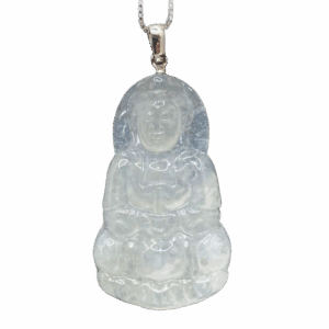 A stunning close-up of the Natural Ice-white Jadeite Avalokitesvara Pendant, showcasing its delicate carving, translucent ice-white jadeite, and elegant 18K white gold clasp. The pendant rests gracefully on a soft velvet background, highlighting its intricate details and serene beauty.