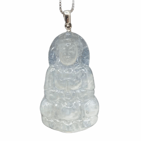 A stunning close-up of the Natural Ice-white Jadeite Avalokitesvara Pendant, showcasing its delicate carving, translucent ice-white jadeite, and elegant 18K white gold clasp. The pendant rests gracefully on a soft velvet background, highlighting its intricate details and serene beauty.