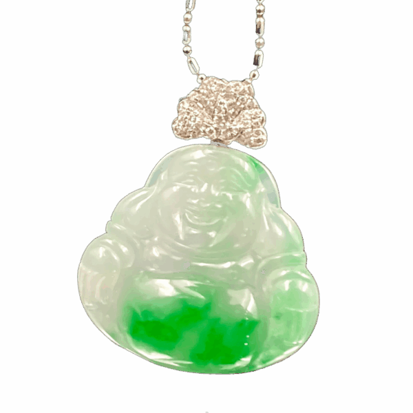 A stunning close-up of the Natural Jadeite Ice-white Buddha Pendant, showcasing its delicate floating green patterns on a translucent base. The 18K white gold diamond clasp sparkles elegantly, highlighting the intricate craftsmanship.