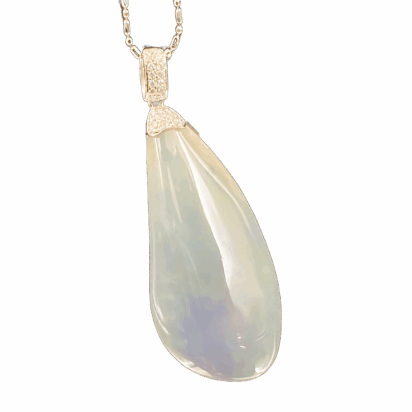 A stunning free-form pendant featuring natural ice-type violet jadeite with a smooth, radiant luster, elegantly set in 18K white gold and accented with sparkling diamonds. The teardrop shape enhances its organic beauty.
