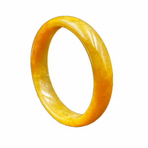A lustrous honey-yellow jadeite bangle with a flawless, glossy surface, showcasing its natural color gradient and delicate internal structure. The round design fits elegantly on the wrist, reflecting refined craftsmanship.