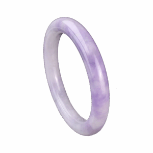 A stunning Natural Violet Jadeite Bracelet resting on a silk cloth, showcasing its serene violet hue and smooth, polished surface. The light reflects off the jadeite's delicate luster, highlighting its elegant charm and intricate craftsmanship.