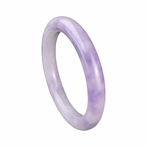 A stunning Natural Violet Jadeite Bracelet resting on a silk cloth, showcasing its serene violet hue and smooth, polished surface. The light reflects off the jadeite's delicate luster, highlighting its elegant charm and intricate craftsmanship.
