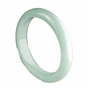 A beautifully polished Natural Douqing Jadeite Bracelet resting on a silk cloth, showcasing its smooth texture and elegant light green hue, symbolizing tranquility and sophistication.