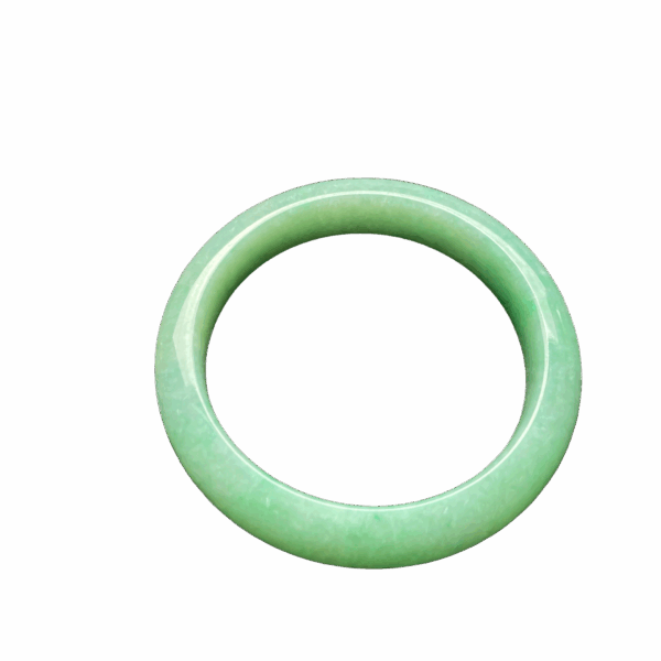 A beautifully polished Natural Jadeite Douqing Bracelet with a smooth round-bar design, showcasing the gentle Douqing color and delicate texture of authentic jadeite.