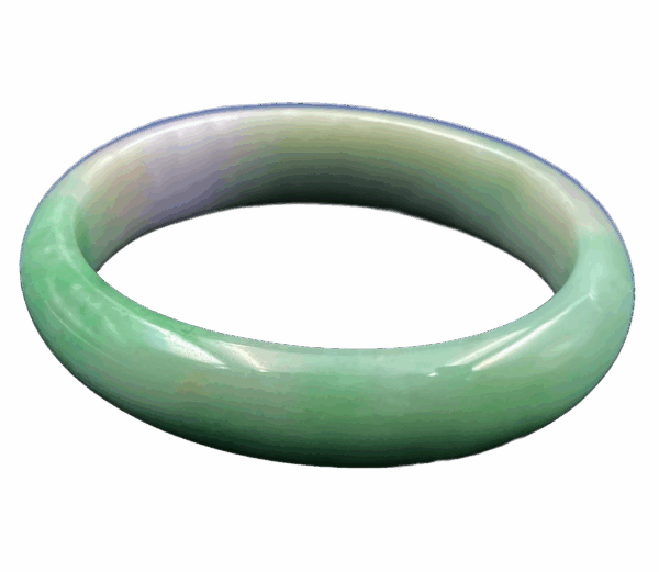 Elegant oval-shaped natural jadeite concubine bracelet with smooth green floating patterns, showcasing subtle gradients on a lustrous translucent surface, resting on a velvet display.
