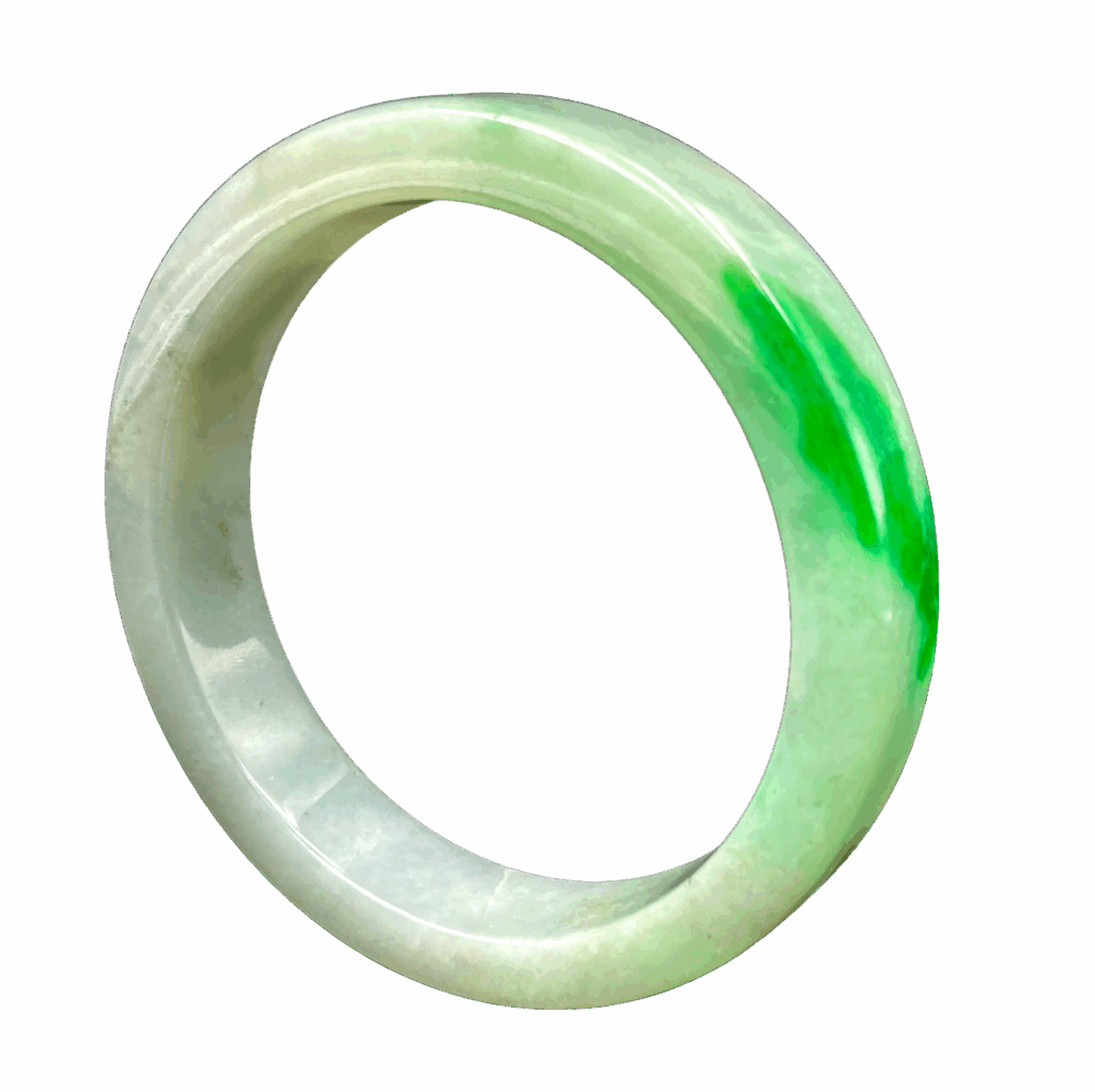 A stunning spicy green jade bangle with intense color and a polished glass-like sheen, resting on a soft fabric background, showcasing its flawless craftsmanship and natural beauty.