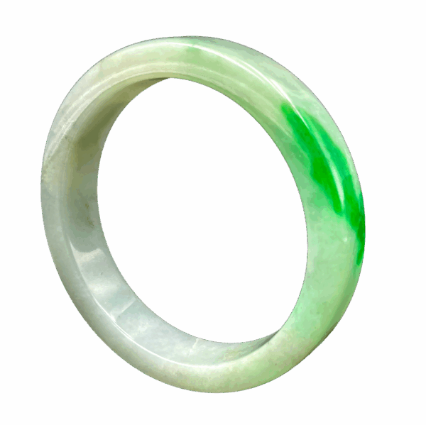 A stunning spicy green jade bangle with intense color and a polished glass-like sheen, resting on a soft fabric background, showcasing its flawless craftsmanship and natural beauty.