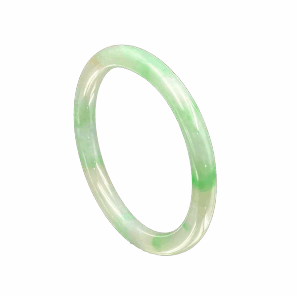 A stunning Natural Jadeite Bai Di Qing Concubine Bracelet featuring smooth, white jadeite with vibrant green patches, elegantly designed for a comfortable fit on the wrist.