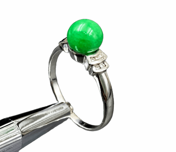 A stunning Natural Douqing Jade Ring featuring a rich green jade centerpiece, elegantly set in polished 18K white gold and adorned with sparkling micro-set diamonds.