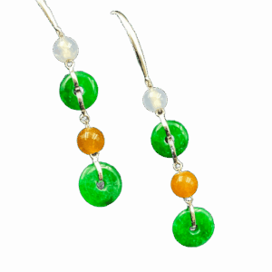 A pair of exquisite icy jadeite safety buckle earrings with natural green hues, delicately suspended from metal hooks and chains. The polished jadeite showcases a cool, translucent glow, complemented by subtle bead accents for a sophisticated layered look.