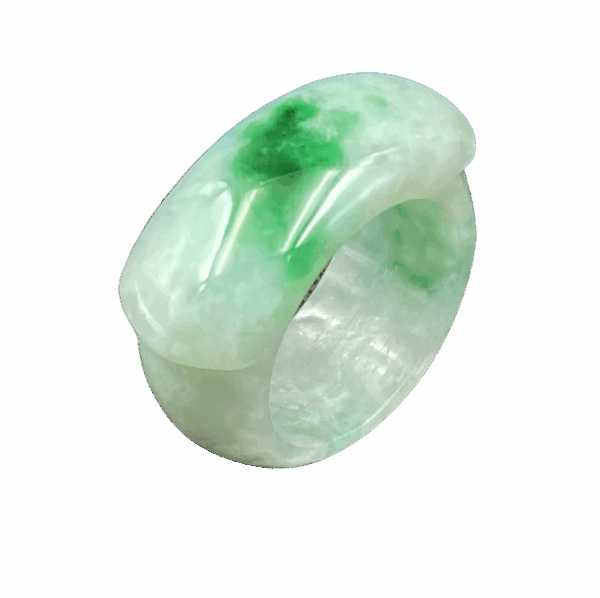 A smooth, polished natural jadeite saddle ring with delicate green hues, resting on a soft fabric background, showcasing its classic and minimalist design.