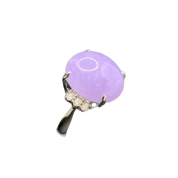 A stunning close-up of the Natural Ice-type Violet Jadeite Cabochon Ring, featuring a lustrous violet jadeite centerpiece set in gleaming platinum with delicate diamond accents. The cabochon cut highlights the jade's translucent glow, while the platinum band adds a touch of modern sophistication.