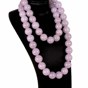 A stunning close-up of natural violet jadeite beads with a smooth, polished surface, showcasing their soft purple-to-pink gradient. The 18K white gold clasp adds a refined touch, complementing the beads' elegance.