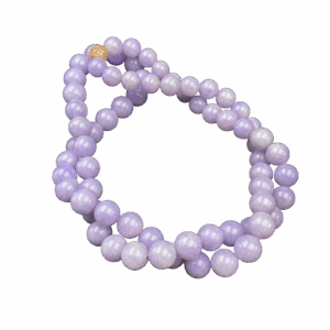 A stunning close-up of the Ice-Type Lavender Jadeite Beaded Necklace, showcasing its translucent, glossy beads in a delicate lavender hue. The 18K gold clasp embedded with diamonds adds subtle luxury, while the smooth, mirror-like finish highlights expert craftsmanship.