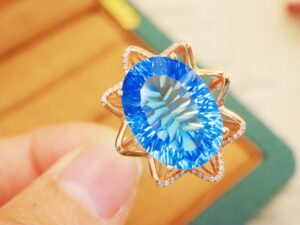 Blue topaz necklace with diamond accents