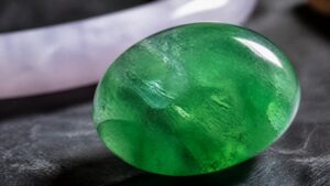 Close-up of luminous green jadeite bracelet revealing rich color and subtle translucency