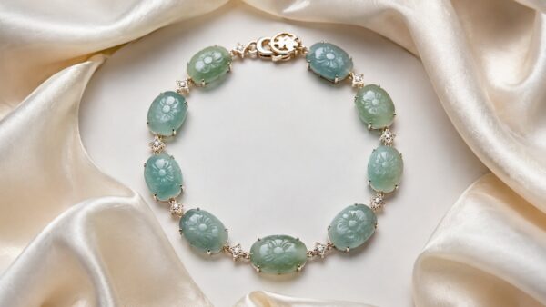 Close-up of a luminous green jadeite bangle on a silk cloth, softly lit for elegance